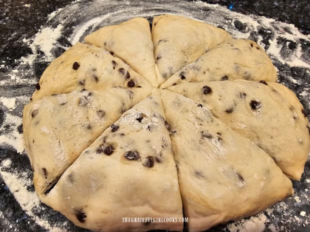 A knife is used to cut the dough into 8 equal-sized pieces.