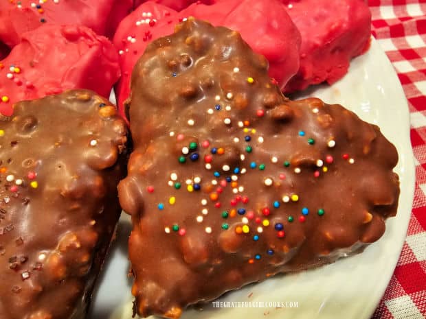 Milk chocolate and red chocolate candy melts are used to cover treats.
