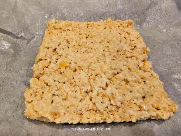 Shape the crispy rice cereal mixture into a square and cool 15 minutes.