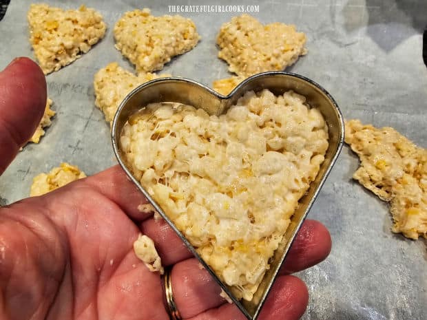 Cut mixture into heart shapes using a heart-shaped cookie cutter.