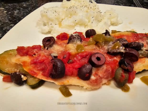 One serving of Dove Sole Mediterranean Style on a plate, with rice on the side.