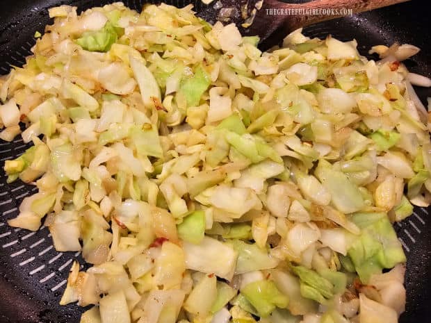 Chopped onions, butter and cabbage are cooked until tender.