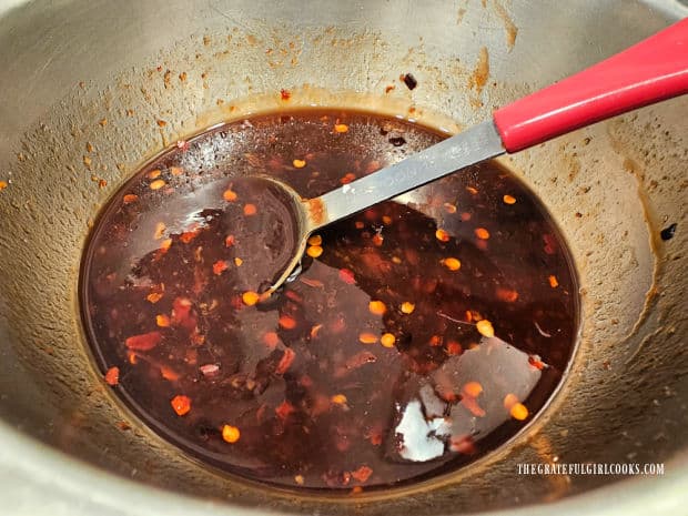 A Szechuan sauce is made by combining several ingredients in a bowl.