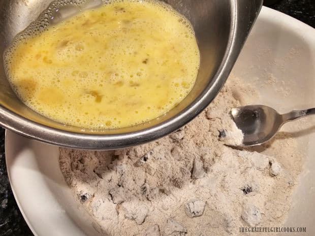 Pouring the banana, milk and egg mixture into the dry ingredient bowl.