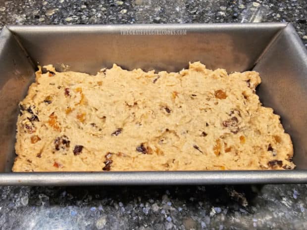 Bread dough batter, in a loaf pan, ready to be baked.