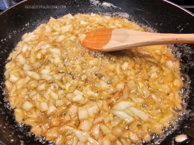 Chopped onions are cooked until tender in browned butter.