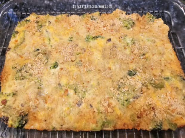 Baked cauliflower broccoli casserole rests on wire rack to cool 2-3 minutes.