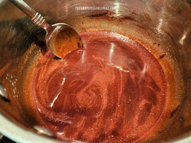 Chocolate and butter sauce cooling in saucepan.