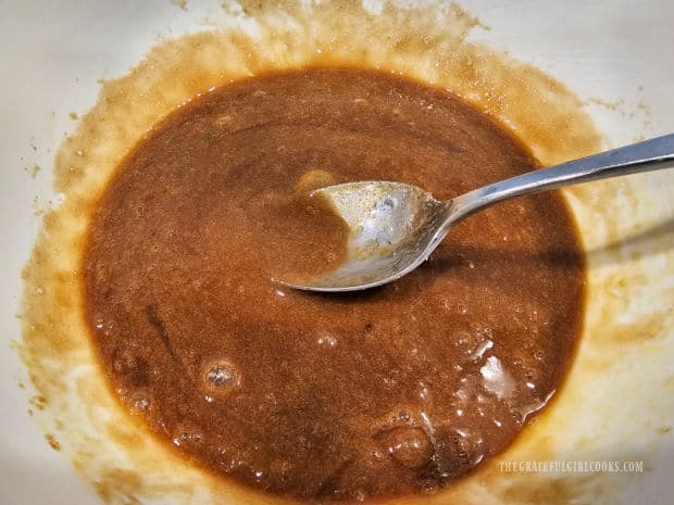 Batter for the tart are combined in white mixing bowl.