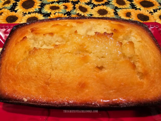 Glazed lemon coconut loaf is ready to be sliced and served.