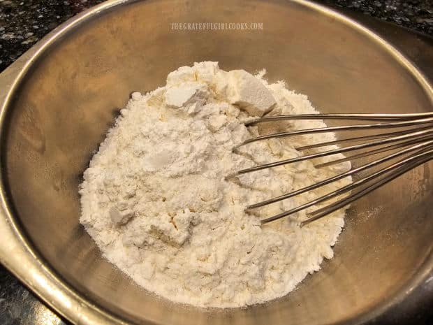 Flour, salt, and baking powder are whisked together in a small bowl.