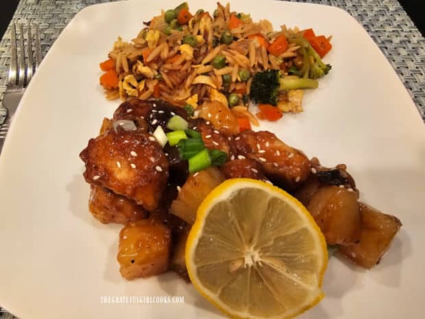 Lemon pineapple chicken bites, served with Asian fried orzo on the side.