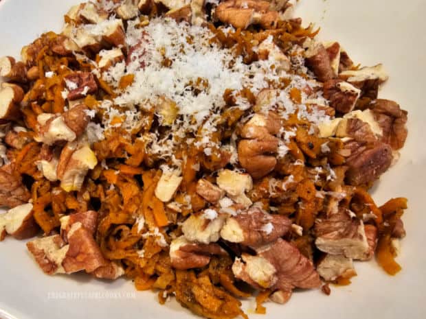 Sweet potato sage noodles garnished with parmesan and toasted pecans.
