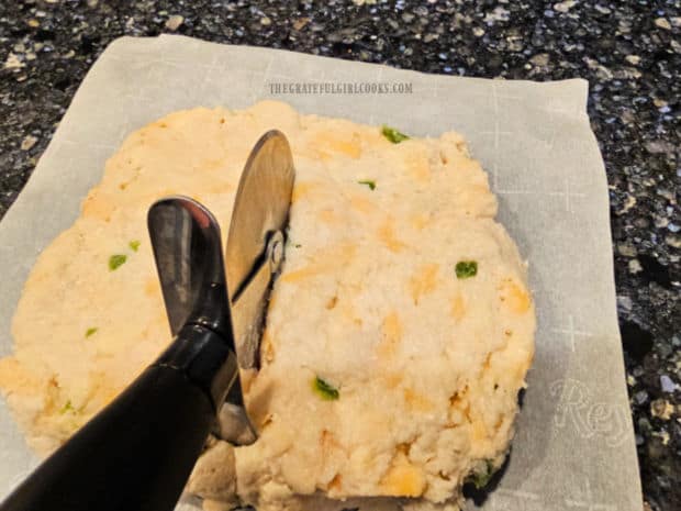 Dough is formed into a square, then cut in 4 equal squares with pizza cutter.