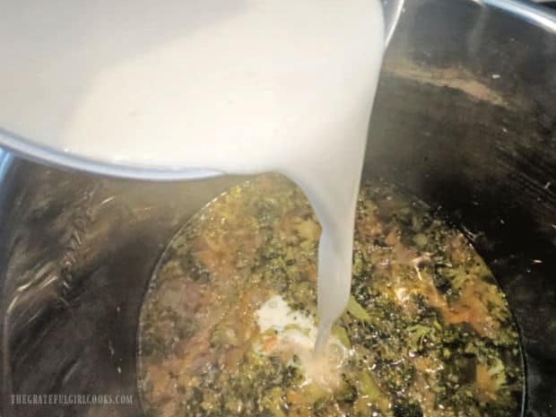 A "slurry" of half and half, cornstarch and hot sauce is added to the soup.