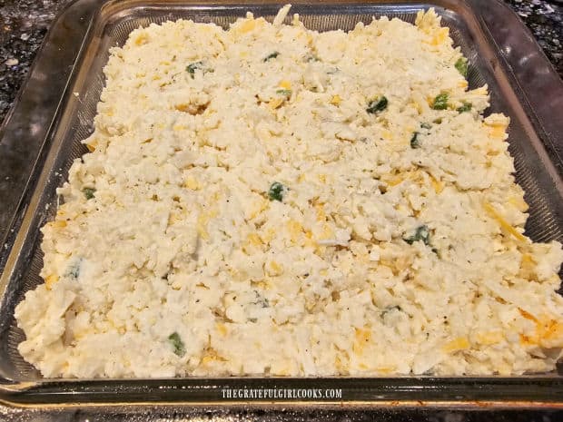 Casserole mixture is pressed into a greased 9" square baking dish.