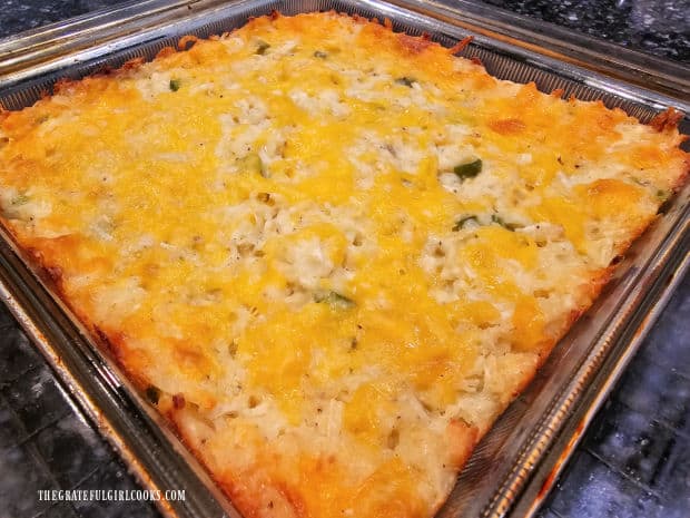 Cheesy hash brown casserole cools on a wire rack after baking.