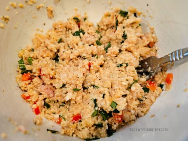 Ingredient for chicken ricotta meatballs are stirred until fully combined.