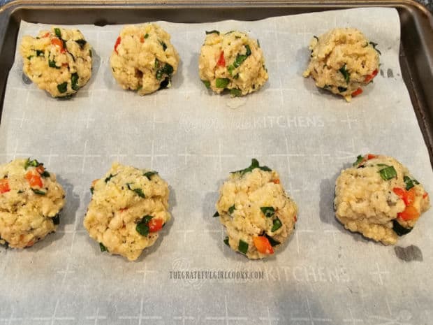 Chicken Ricotta Meatballs For 2 (on parchment paper) are ready to be baked.