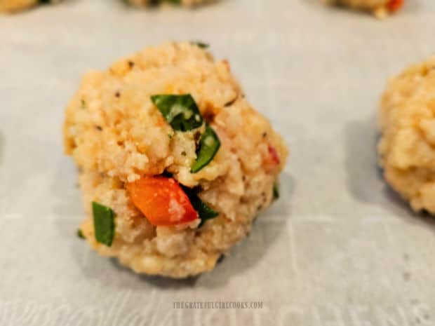 Meatball mixture is shaped into eight, 1½" wide meatballs.
