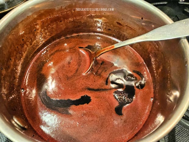 Chocolate syrup is removed from heat when done, and vanilla is added.