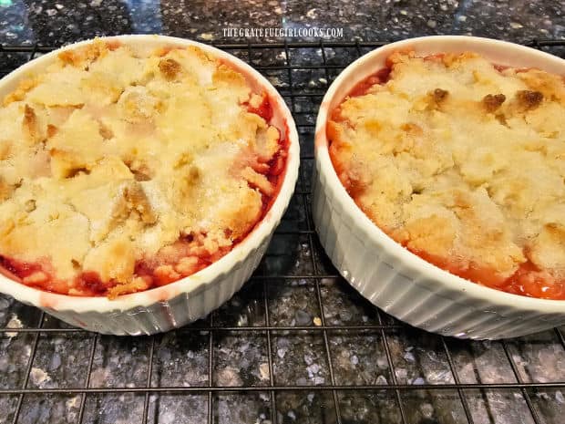 After baking, the strawberry rhubarb cobblers cool on a wire rack.