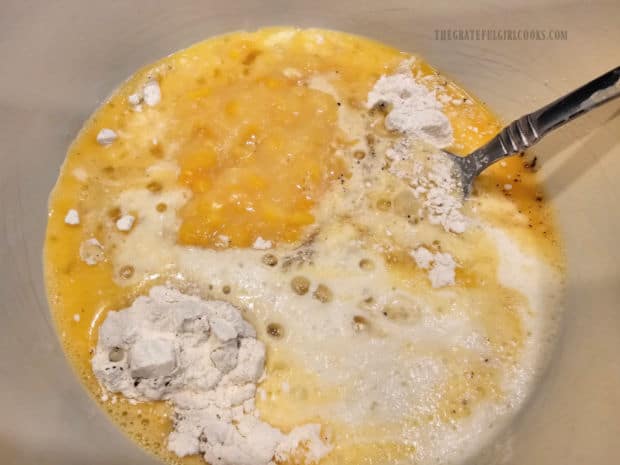 Creamed corn and other dry ingredients are added to the beaten eggs.