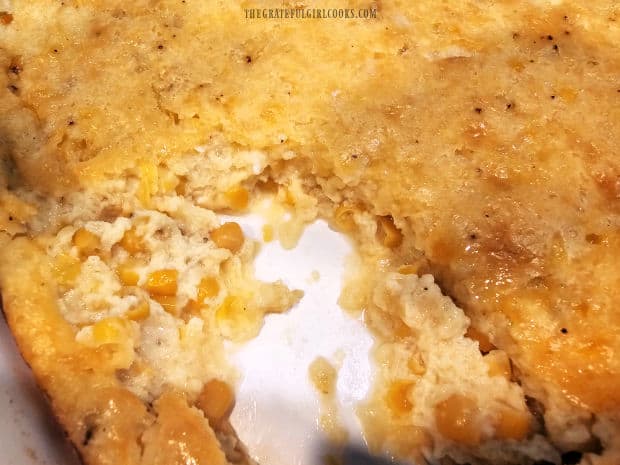 A serving portion has been removed, revealing the corn inside.