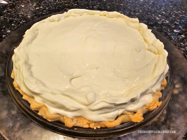 One very large pie is filled with the cream cheese and whipped topping mixture.