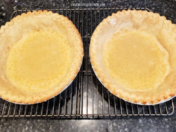 Two pie crusts, cooling after being pre-baked.