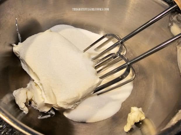Softened cream cheese and sugar are mixed together until smooth.