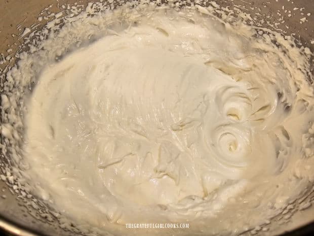 The whipped topping is light and fluffy with soft peaks after being beaten with a mixer.