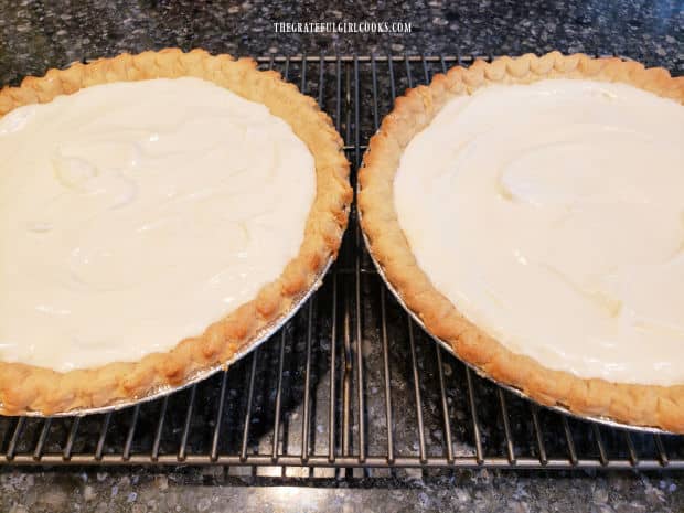 Two pre-baked crusts are filled with the cream cheese pie filling.