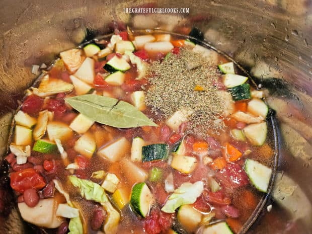 Italian seasoning and a bay leaf are added to soup before cooking.