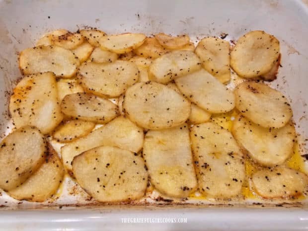After being turned over, the potatoes continue roasting until light brown and slightly crisp.