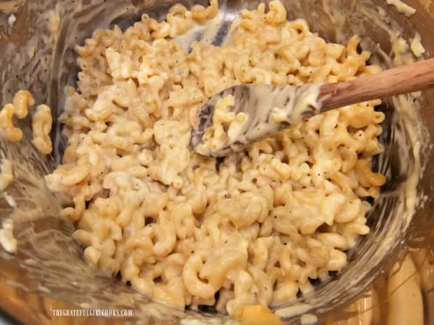 Butter, salt and pepper are added to Instant Pot macaroni and cheese and heated through.