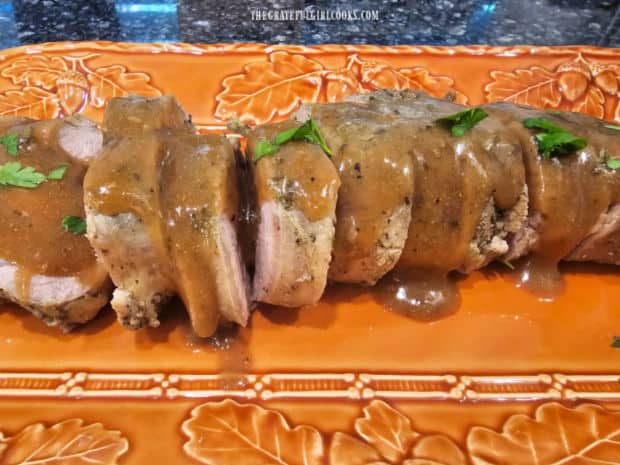 Instant Pot Pork Tenderloin and Gravy is sliced and served on a platter.