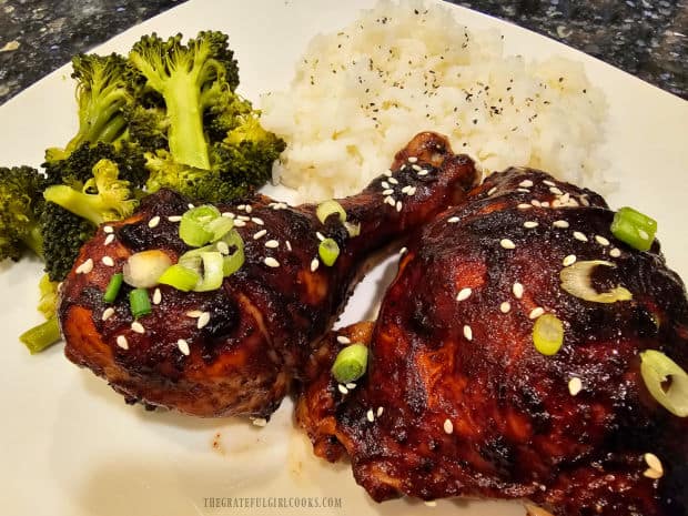Rice and broccoli are served along with 2 pieces of Asian BBQ-glazed chicken.