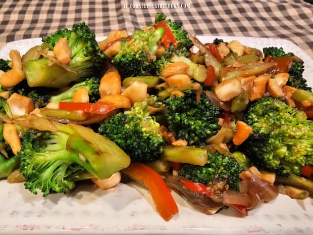A serving dish with the broccoli cashew stir-fry on it, ready for serving.