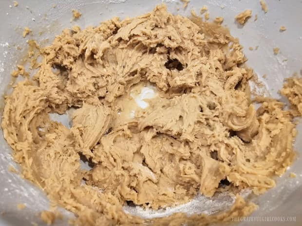 Cookie dough batter is thick and well-combined in a large bowl.