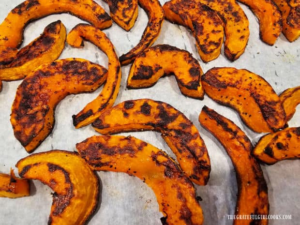 After baking, squash slices are well-browned on both sides.