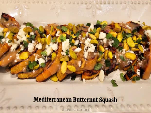 Mediterranean Butternut Squash is a flavorful side dish with roasted squash topped with tahini dressing, feta cheese, mint, and pistachios!