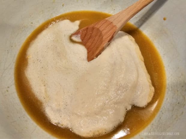 Oatmeal Molasses Dinner Rolls - The Grateful Girl Cooks! Yeast mixture is added to the melted butter mixture and stirred in until combined.