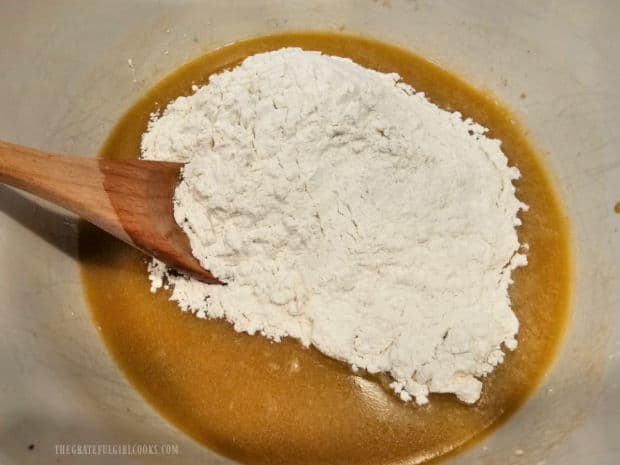 Oatmeal Molasses Dinner Rolls - The Grateful Girl Cooks! All-purpose flour is stirred into the batter for the oatmeal molasses dinner rolls.