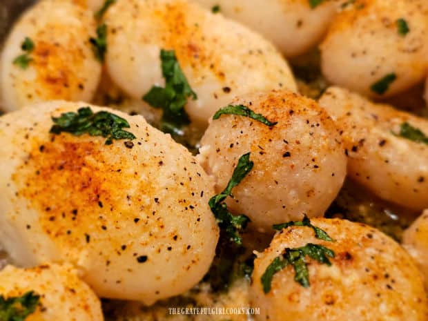 Each of the roasted whole potatoes is golden in color once done.