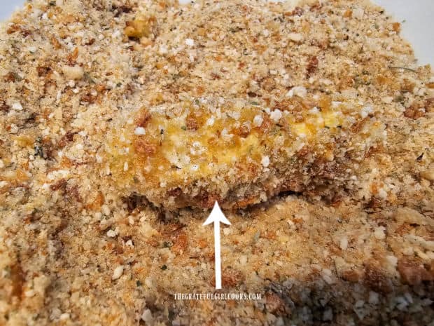 Flour and egg-coated cheese is rolled in seasoned breadcrumb mixture.