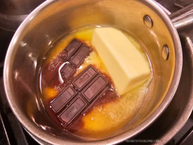 Unsweetened chocolate and butter are melted in a double boiler.