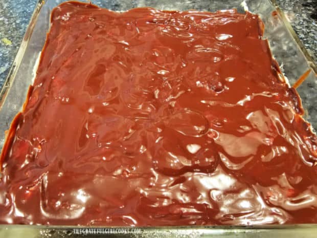 Chocolate glaze is spread on top of the mint filling, then refrigerated until hardened.