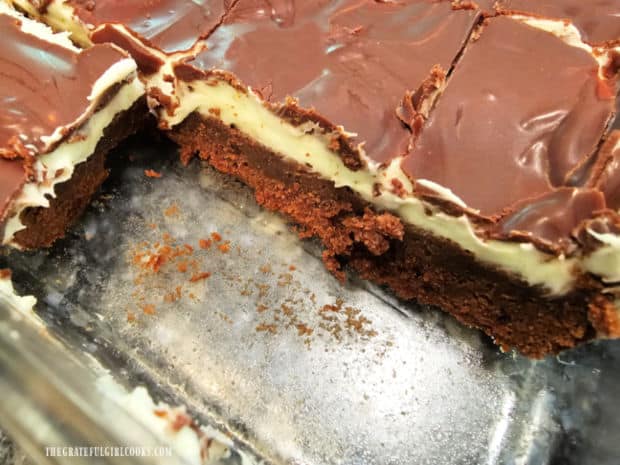 Crème de menthe brownies are cut, revealing three distinct layers.