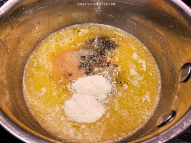 Spices are mixed with melted butter in saucepan to make the seasoning sauce.